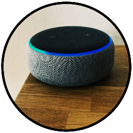 Alexa voice-activated assistant sitting on the corner of a table